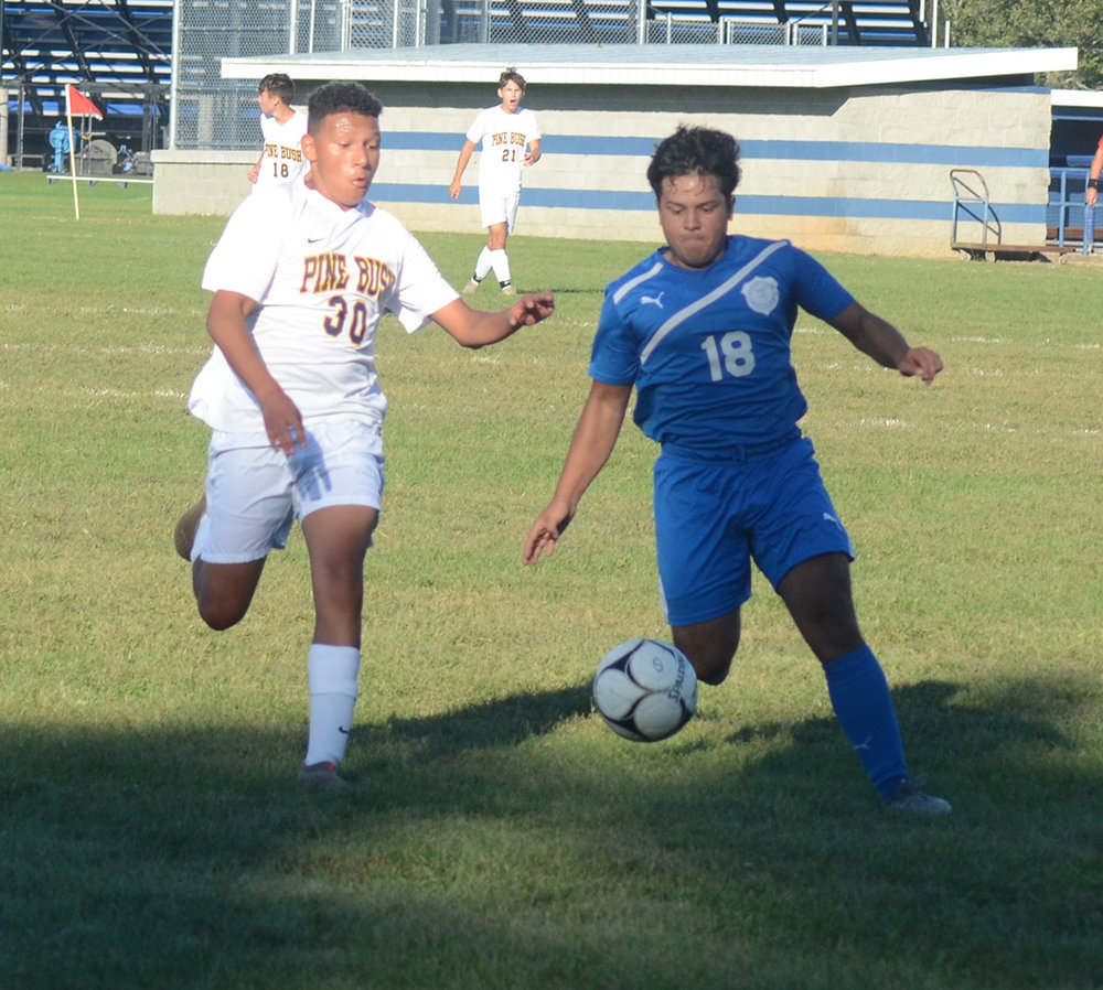 Valley Central’s Bryan Arroyo and Pine Bush’s Imanol Florez chase down a loose ball during Friday’s OCIAA boys’ soccer game at Valley Central High School in Montgomery.
